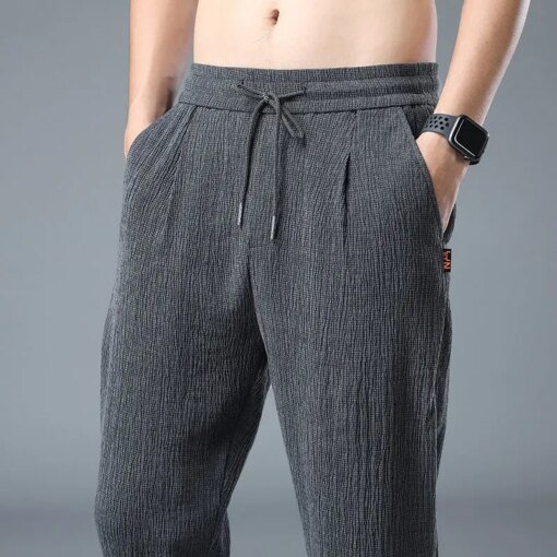 Buy Summer Thin Elastic Casual Pants Men Solid Pleated Ice Silk Strap High Waist Drawstring Pocket Loose Straight Trousers 2023 New online shopping cheap